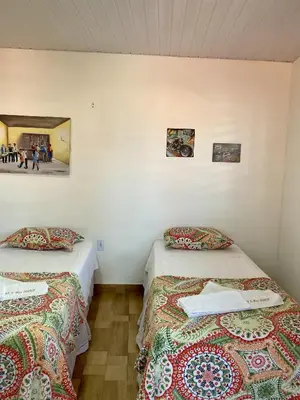 Uma cama ou camas num quarto em Pousada São Pedro