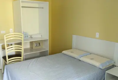 Uma cama ou camas num quarto em Pousada NS Fátima