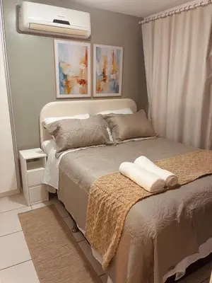 Uma cama ou camas num quarto em Charme Beach Class - a poucos passos da praia