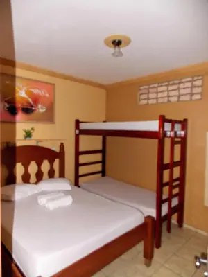 Uma cama ou camas num quarto em Léa Pousada