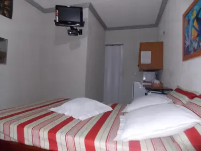 Uma cama ou camas num quarto em Léa Pousada