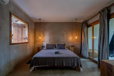 Uma cama ou camas num quarto em Villa Mango Jeri