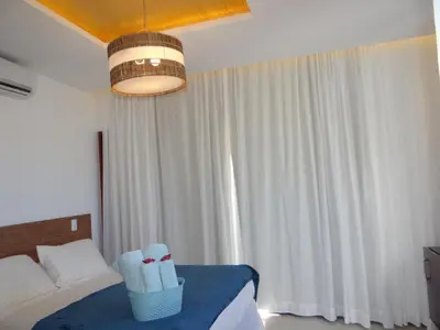 Uma cama ou camas num quarto em Junduh Brasil Pousada e Restaurante