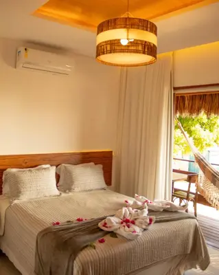 Uma cama ou camas num quarto em Junduh Brasil Pousada e Restaurante
