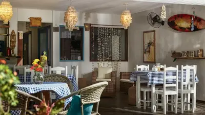 Um restaurante ou outro lugar para comer em Pousada AGUA SALGADA