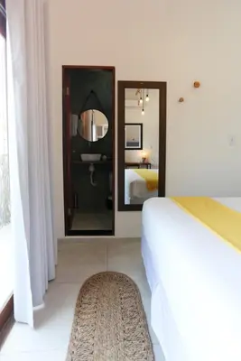 Uma cama ou camas num quarto em Pousada Movimento