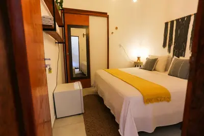 Uma cama ou camas num quarto em Pousada Movimento