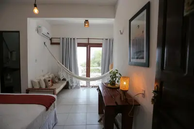 Uma cama ou camas num quarto em Pousada Movimento