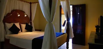 Uma cama ou camas num quarto em Pousada Azul Marinho