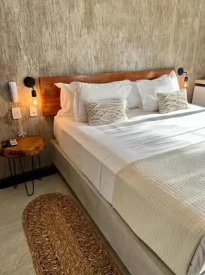 Uma cama ou camas num quarto em Casa Valentini Pousada