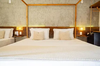 Uma cama ou camas num quarto em Casa Valentini Pousada