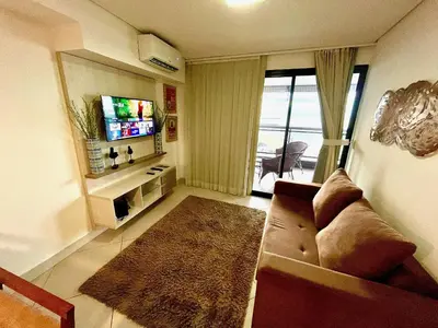 Uma televisão e/ou sistema de entretenimento em Landscape Beira Mar torre Platinum - vista incrível mar