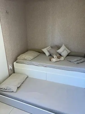 Uma cama ou camas num quarto em Apartamento térreo Aquaville