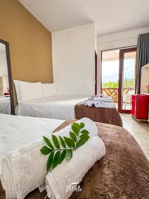 Uma cama ou camas num quarto em Pousada Villa Pontinha