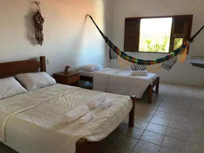 Uma cama ou camas num quarto em Beach House Paracuru - Casa da Gabi