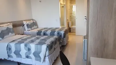 Uma cama ou camas num quarto em APTO LUXO EM HOTEL - BEIRA MAR FORTALEZA