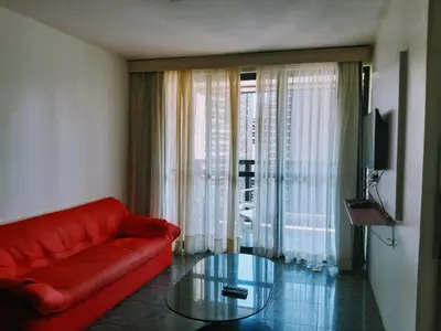Uma área de estar em Hotel Flat Atlântico, Apartamento Com 02 Quartos