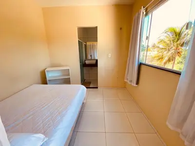 Uma cama ou camas num quarto em Casa em flecheiras com piscina