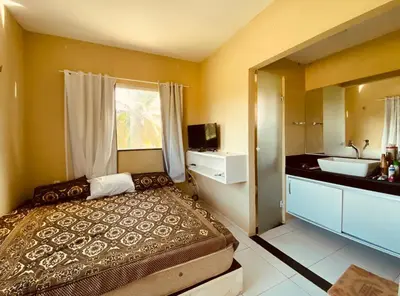 Uma cama ou camas num quarto em Casa em flecheiras com piscina