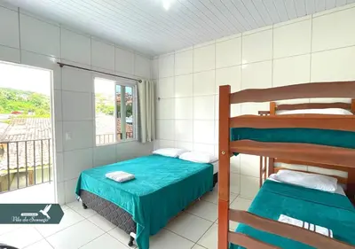 Uma cama ou camas num quarto em Vila do Sossego
