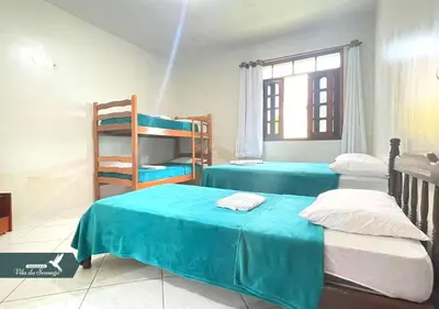 Uma cama ou camas num quarto em Vila do Sossego