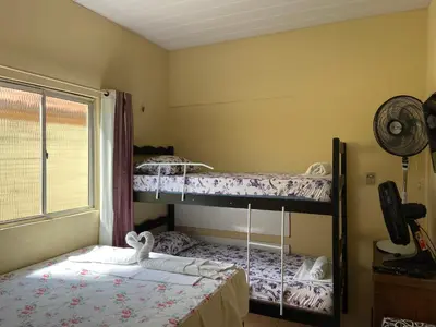 Uma cama ou camas num quarto em Cantinho Casa Grande