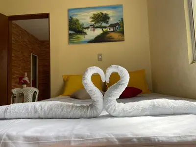 Uma cama ou camas num quarto em Cantinho Casa Grande
