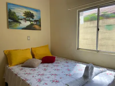 Uma cama ou camas num quarto em Cantinho Casa Grande