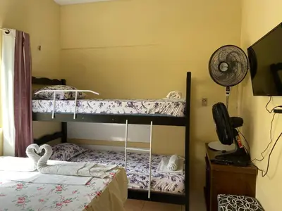 Uma cama ou camas num quarto em Cantinho Casa Grande