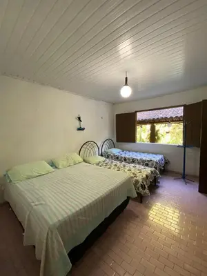 Uma cama ou camas num quarto em Rancho Manacá