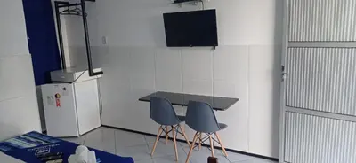 Uma televisão e/ou sistema de entretenimento em Hotel Arco-Íris