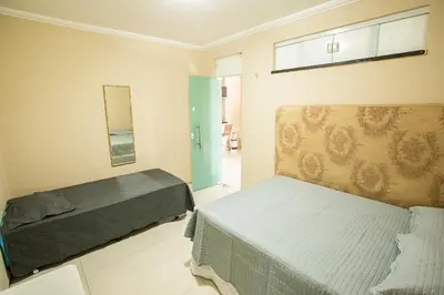 Uma cama ou camas num quarto em Porto das Dunas Casa Temporada Estilo e Conforto