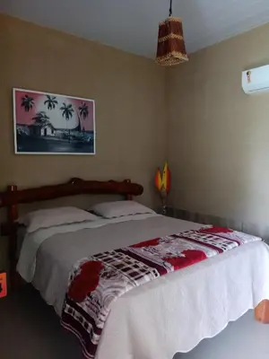 Uma cama ou camas num quarto em Nascer do Sol Kitesurf House