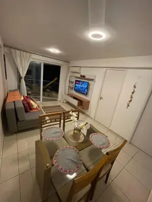 Uma área de estar em Apartamento com Vista para o Mar Último Andar
