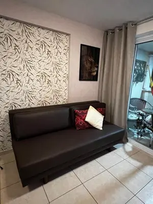 Uma área de estar em Apartamento com Vista para o Mar Último Andar