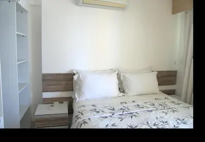 Uma cama ou camas num quarto em Grupo Vip Beach Class Fortaleza