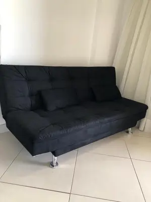 Uma área de estar em Alugo Temporada apartamento frente ao mar de Fortaleza vista panorâmica do Mar
