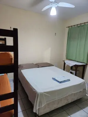 Uma cama ou camas num quarto em Hospedaria Encontro das Águas