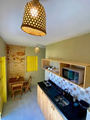 A cozinha ou kitchenette de Chalés Amarante
