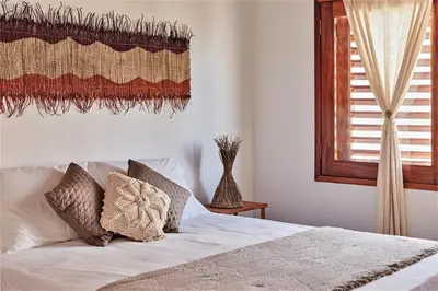 Uma cama ou camas num quarto em Condomínio Villa Conduru - Casa completa