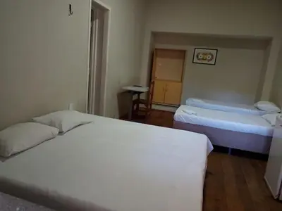 Uma cama ou camas num quarto em Hotel Oiticica