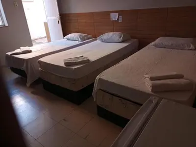 Uma cama ou camas num quarto em Hotel Oiticica