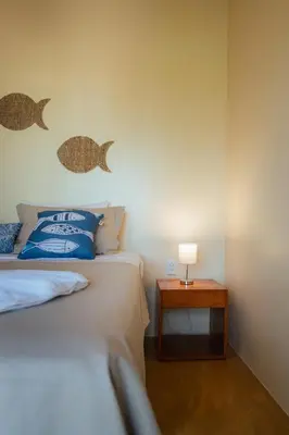 Uma cama ou camas num quarto em Vila Harmonia sua casa na Praia do Preá