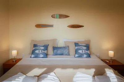 Uma cama ou camas num quarto em Vila Harmonia sua casa na Praia do Preá