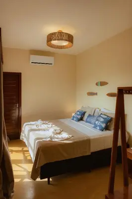 Uma cama ou camas num quarto em Vila Harmonia sua casa na Praia do Preá