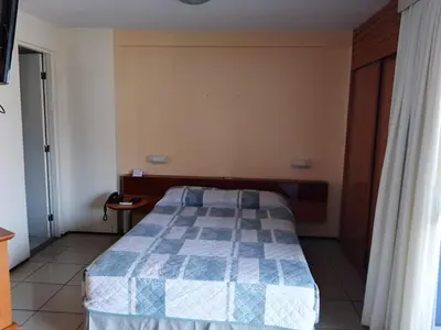 Uma cama ou camas num quarto em Praia Mansa Suite Hotel apto de 1 quarto