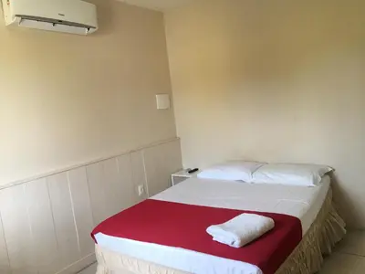 Uma cama ou camas num quarto em Top Home Pousada
