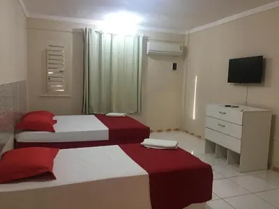 Uma cama ou camas num quarto em Top Home Pousada