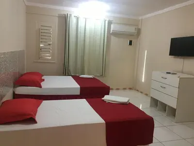 Uma cama ou camas num quarto em Top Home Pousada