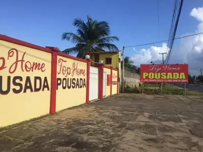 Um certificado, prémio, placa ou documento mostrado em Top Home Pousada